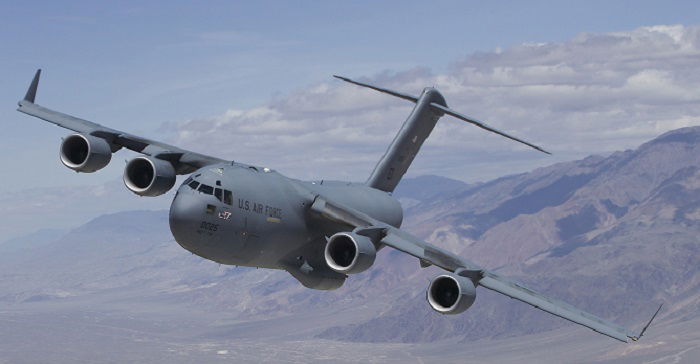 The C-17 Globemaster III T-1 flies over Owens Valley, Calif., for a test sortie. Edwards welcomed home the aircraft after 208 days of life extension modifications in San Antonio. T-1 is the first Air Force C-17 built to perform developmental testing. The aircraft is scheduled to perform flight testing to include airdrop improvements and core-computer replacement testing. (Air Force photo)